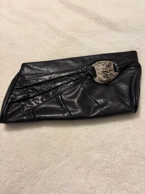 Black Leather Clutch with Textured Accent and ceramic medallion. Vintage